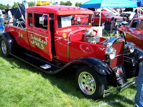 1972 Ford Ranchero - This vintage tow truck, labeled "Smoken JOE'S", is parked on grass at an outdoor car show.