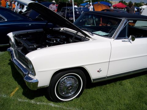 1972 Ford Ranchero - White 1967 Chevrolet Nova SS shows its engine bay at an outdoor car show.
