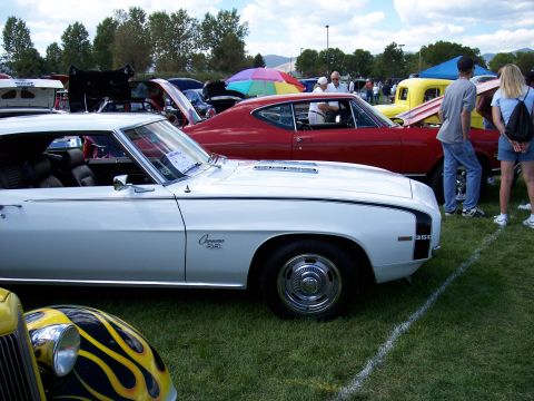 1972 Ford Ranchero - White 1969 Camaro SS parked at an outdoor car show with other vehicles visible.