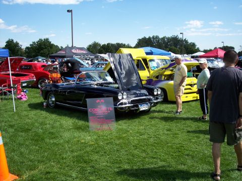 1972 Ford Ranchero - A black 1959 Corvette convertible is displayed with its hood open at an outdoor car show.