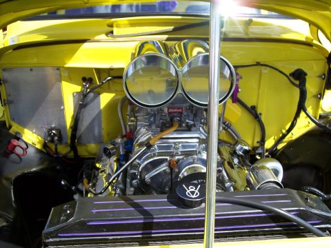 1972 Ford Ranchero - A highly customized engine bay features a supercharger and dual carburetors, intricate mechanical details.