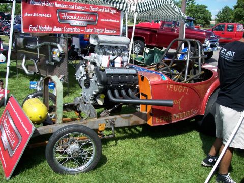 1972 Ford Ranchero - A custom-built dragster is displayed at an outdoor event, with a prominent engine and roll cage.