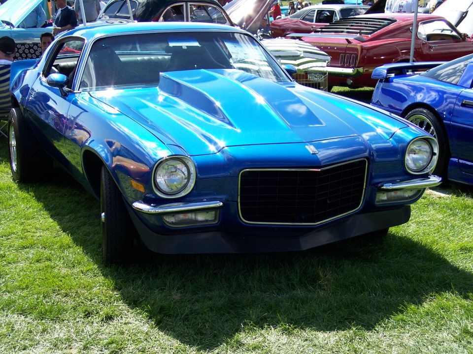 Blue 1970s muscle car with hood scoop