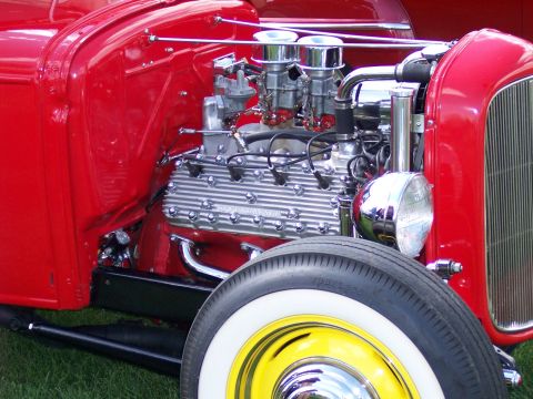 1972 Ford Ranchero - A polished V8 engine with chrome accents and dual carburetors is visible on a classic hot rod.