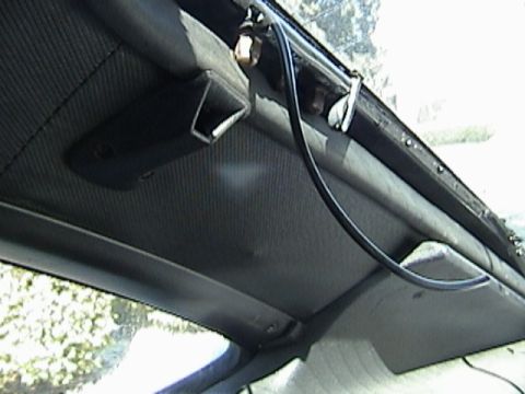1977 Ford Mustang - Close-up view of the car's interior ceiling panel and trim, with a visible black wire.