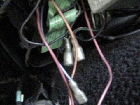 1977 Ford Mustang - This image shows a close-up view of a vehicle's electrical wiring harness with multiple connectors and wires.