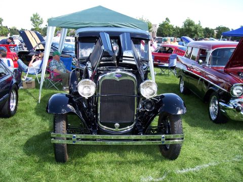 1972 Ford Ranchero - A classic black automobile from the 1930s is displayed with its hood open at an outdoor car show.