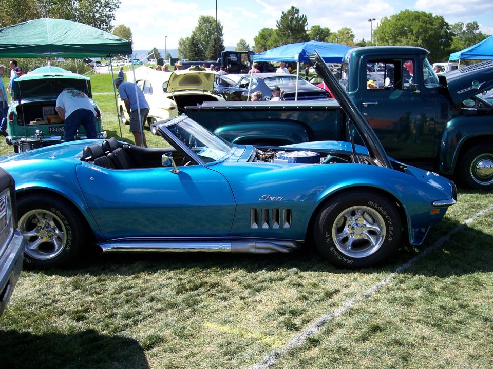 Blue 1969 Corvette convertible side view with hood open