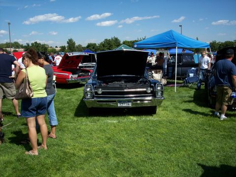 1972 Ford Ranchero - AMC Ambassador on display at a car show, with its hood open to reveal the engine bay.