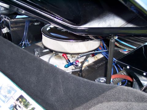 1972 Ford Ranchero - The engine bay of a vehicle is visible, an air filter and various engine parts.