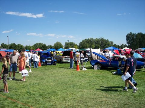 1972 Ford Ranchero - A sunny day at a car show with many vehicles on display.