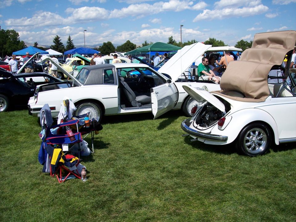 White coupe and convertible at car show