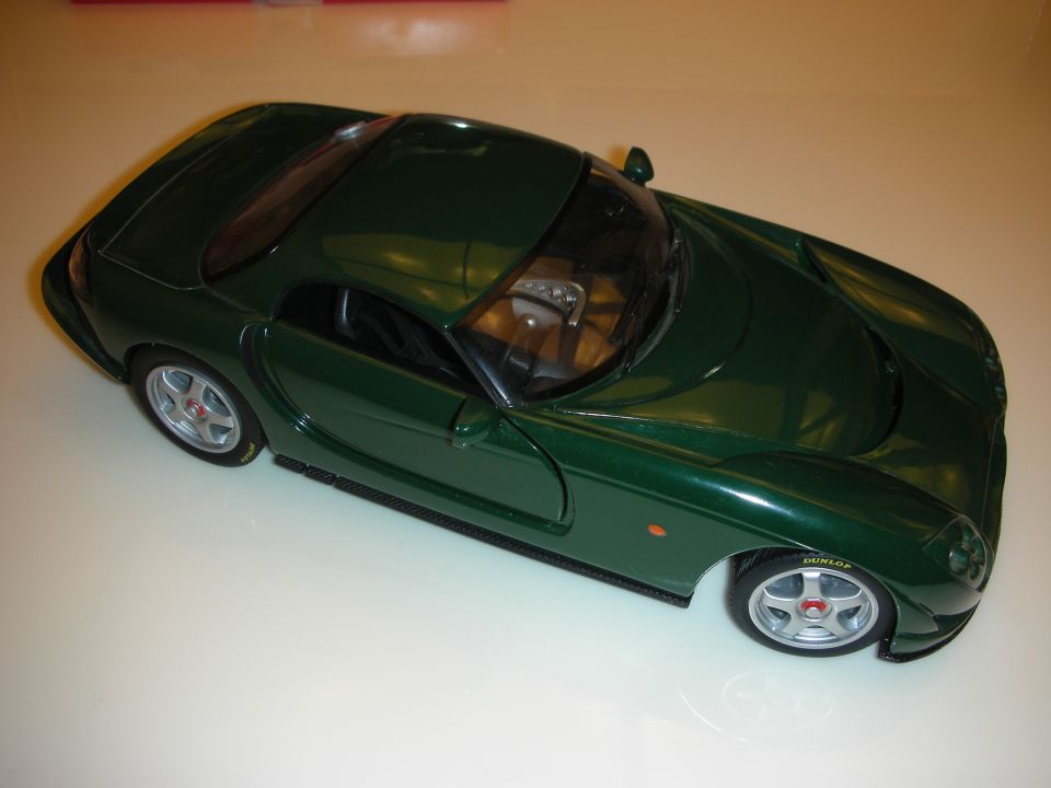 British racing green diecast sports coupe model, top three-quarter view