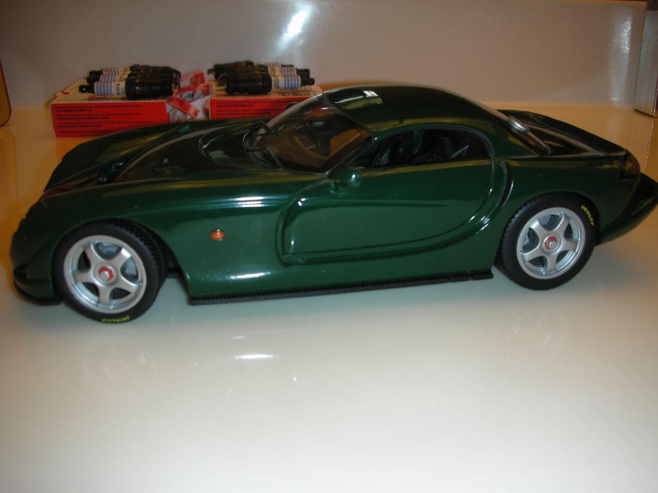 British racing green diecast sports coupe model, full side profile