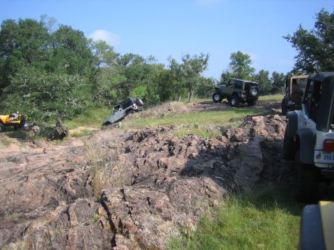 2001 Jeep Wrangler - Jeeps tackle a challenging rocky trail during an off-road event.