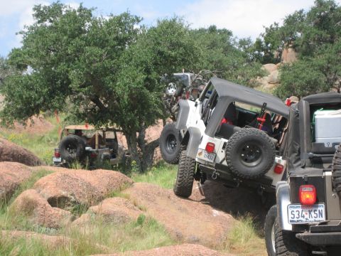 2001 Jeep Wrangler - Jeeps tackle a challenging off-road course in a rocky, natural environment.