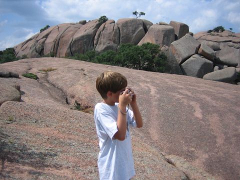 2001 Jeep Wrangler - A young boy captures the natural beauty of a vast, rocky landscape with his camera.