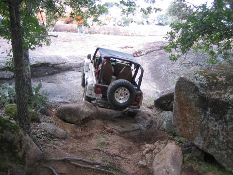 2001 Jeep Wrangler - Jeep Wrangler navigates a challenging rocky trail during an off-road event.