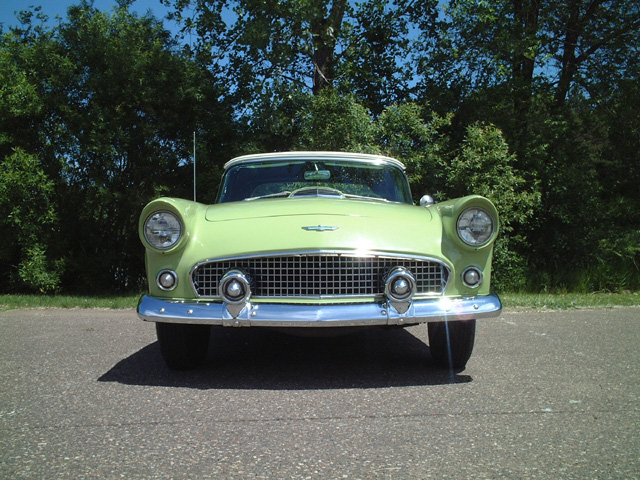 1956 Ford Thunderbird, front view, light green exterior, parked on asphalt