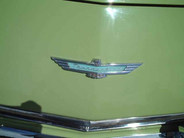Green 1956 Ford Thunderbird hood emblem with 'Thunderbird' and 'Ford' text