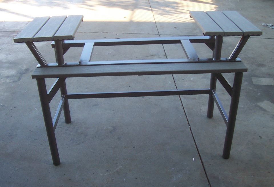 Metal table frame with wooden seats, front view
