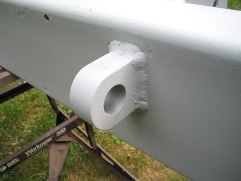 1979 Ford Bronco - Close-up of a painted metal part, likely a bumper or frame section, with a tow hook.