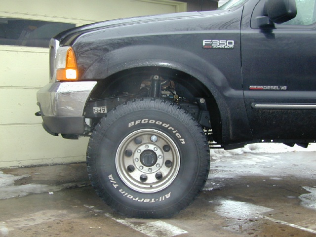 Black Ford F-350 Super Duty front wheel with BFGoodrich All-Terrain tire