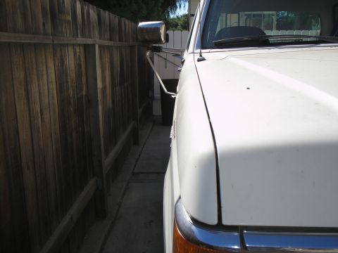 1990 Ford Bronco - Close-up of a 1990 Ford Bronco's side mirror and front fender.