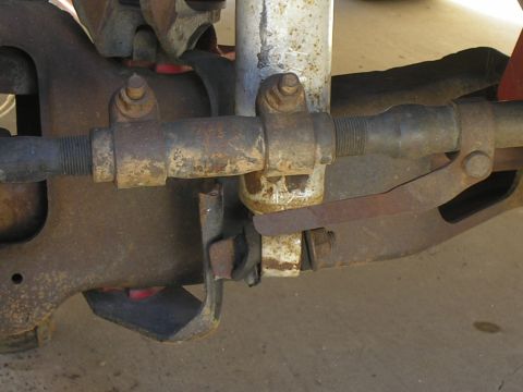 1990 Ford Bronco - Close-up view of weathered vehicle suspension components, showing rust and wear.