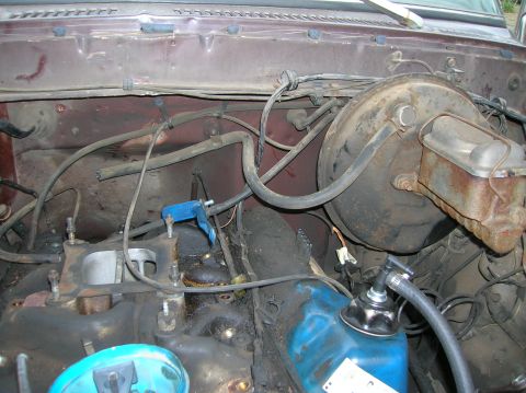 1978 Ford F-250 - Engine bay of a 1978 Ford F-250, the brake booster and intake manifold.