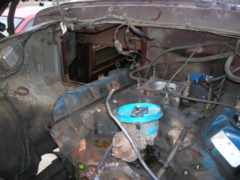 1978 Ford F-250 - The engine bay of a 1978 Ford F-250, a view of the distributor and carburetor during an engine teardown.