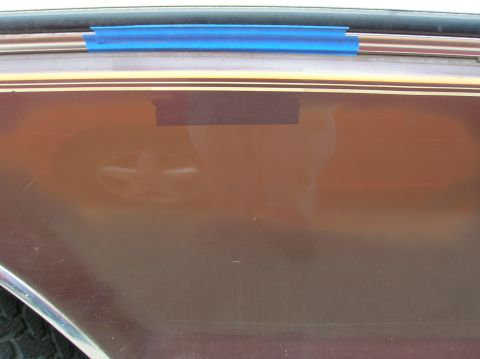 1978 Ford F-250 - Side view of a 1978 Ford F-250 showing pinstriping and blue tape on the body panel.