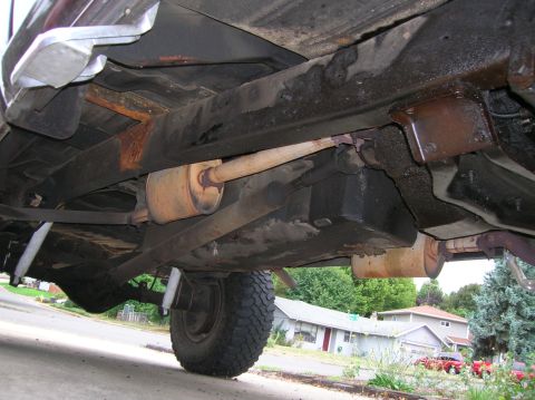 1978 Ford F-250 - A detailed look at the undercarriage of a truck, showing the frame, exhaust, and suspension components.