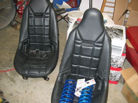 1992 Ford Mustang - Two black racing seats are shown with blue springs and a box labeled 'Intake Manifold' in the background.