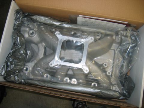 1992 Ford Mustang - Unboxed aluminum intake manifold, likely for a V8 engine, still in protective plastic.