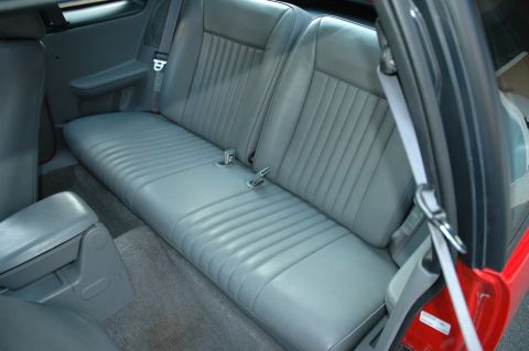 1993 Ford Mustang - Interior view of the rear seats and armrest of a 1993 Ford Mustang Cobra.
