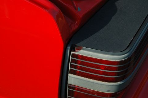 1993 Ford Mustang - The horizontal red and clear stripes on this tail light assembly are characteristic of a 1990s Ford Mustang.