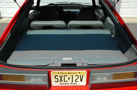 1993 Ford Mustang - Rear view of a red 1993 Ford Mustang Cobra, showing the trunk area and license plate.