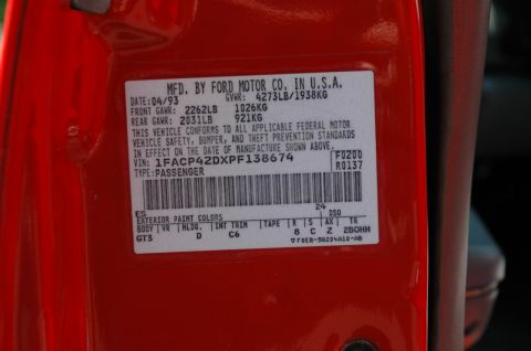 1993 Ford Mustang - This door jamb sticker from a 1993 Ford Mustang shows the VIN, manufacturing date, and exterior paint color information.