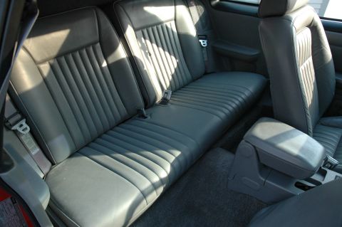 1993 Ford Mustang - Interior view of car's rear seating area and center console.