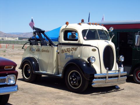 1981 Kenworth W900A - This vintage Ford tow truck displays "Barlow Towing" on its door and "Affordable Service" on the bed.