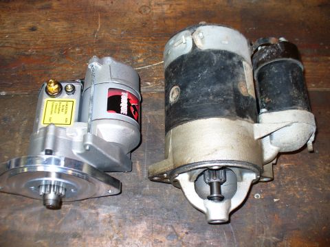 1978 Ford Bronco - A comparison of two different vehicle starters, one new and one old, is shown on a workbench.
