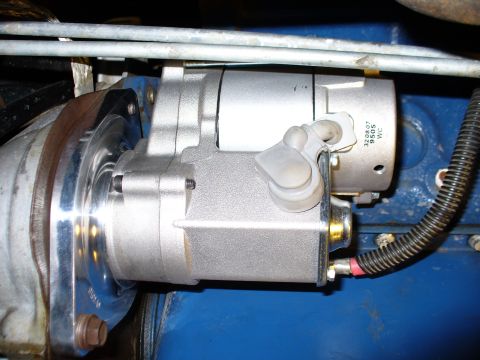 1978 Ford Bronco - Close-up view of a mini starter motor, showing part number 320807 9505 WC.