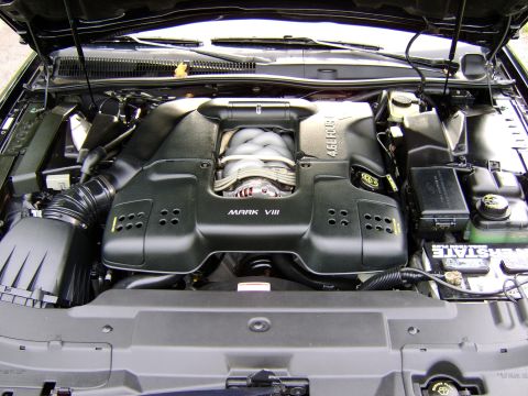 1996 Mercury Grand Marquis - Close-up view of a car's engine bay, showing the "MARK VIII" and "4.6L FOUR" engine covers.