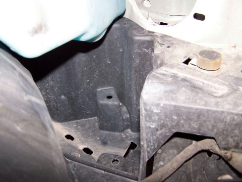 2000 Ford Crown Victoria - Area directly below airbox Cutting this would theoretically allow access, via tubing, to air from in front of the tire/behind bumper
