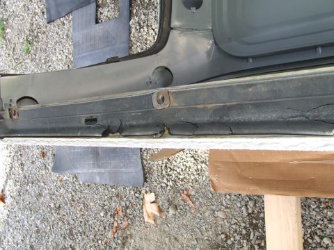 1979 Ford Bronco - Worn door seal on a vehicle part, showing significant cracking and deterioration.