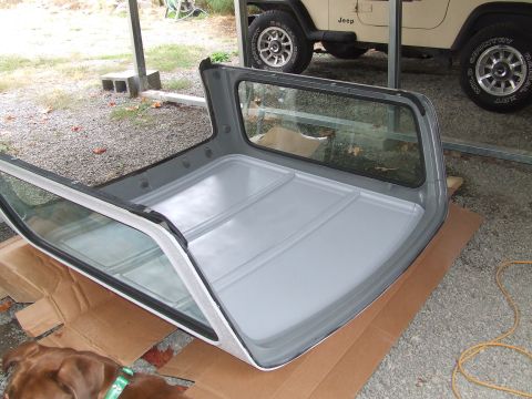 1979 Ford Bronco - Removable hardtop for a Jeep Wrangler is shown, with another Jeep in the background.