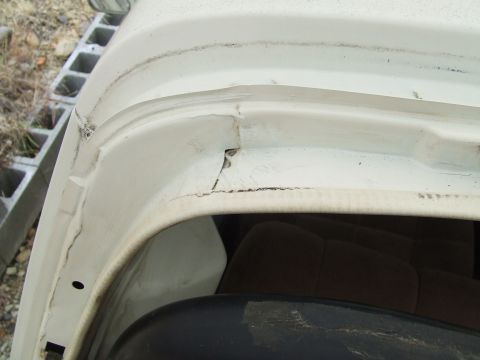 1979 Ford Bronco - Detail shot of the door frame and surrounding bodywork on a white vehicle.