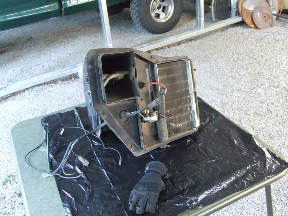 Heater core assembly with wiring and glove on a table