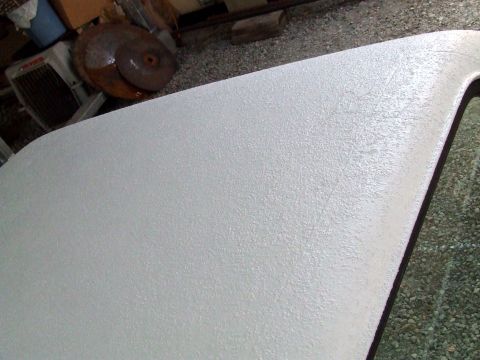 1979 Ford Bronco - The image shows a textured white surface, likely a part of a vehicle, with some background clutter.